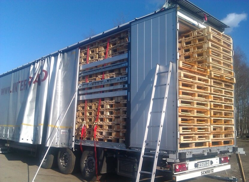truck full of wooden pallets